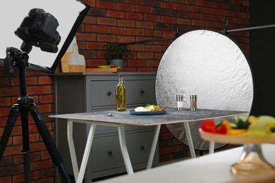 Composition with mozzarella salad on black table in professional photo studio. Food photography