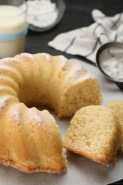 Delicious freshly baked sponge cake on table, closeup