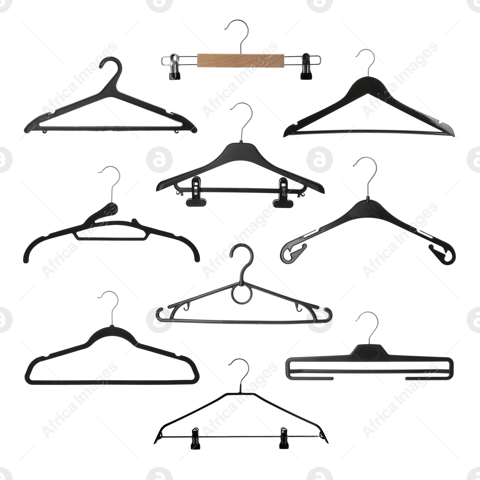 Image of Set with different empty hangers on white background