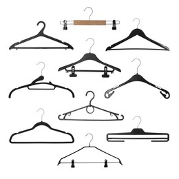 Set with different empty hangers on white background