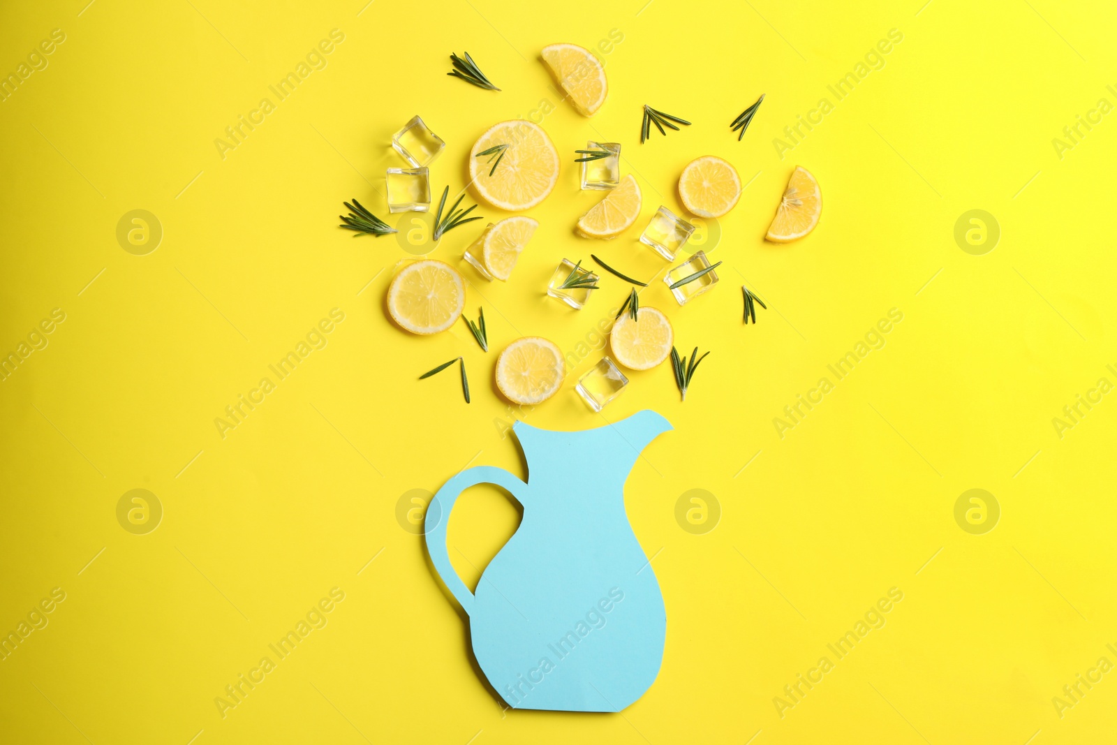 Photo of Creative lemonade layout with lemon slices, rosemary and ice on yellow background, top view