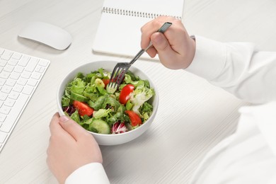 Office employee having business lunch at workplace, closeup