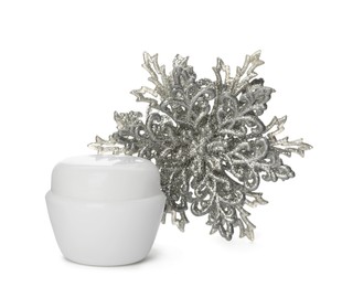 Jar of cream and snowflake on white background. Winter skin care