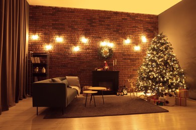 Beautiful tree with festive lights and Christmas decor in living room. Interior design