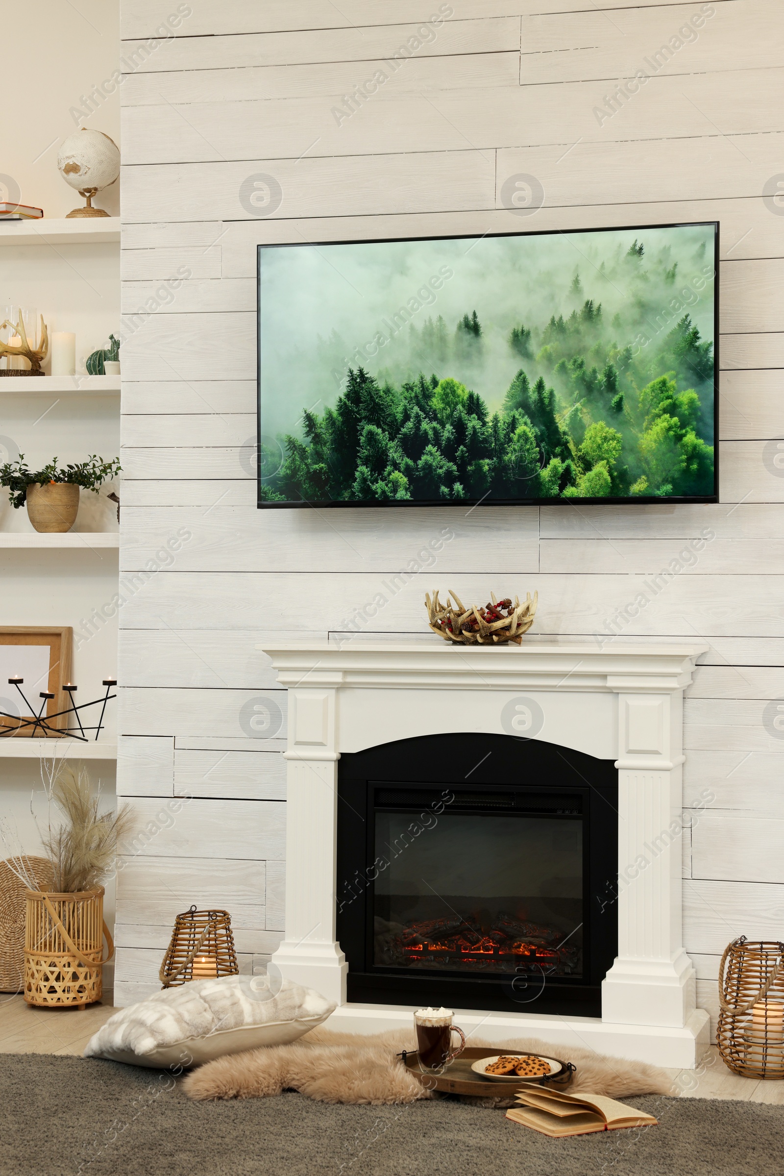 Photo of Cozy living room interior with decorative fireplace