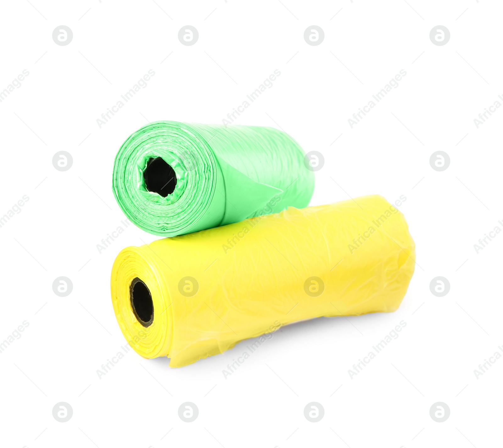 Photo of Colorful dog waste bags on white background
