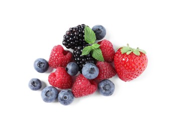 Photo of Many different ripe berries and mint leaves isolated on white, top view