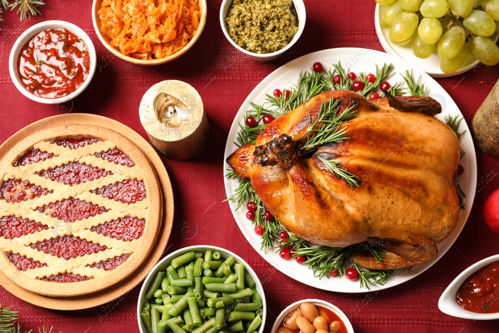 Photo of Traditional festive dinner with delicious roasted turkey served on table, flat lay
