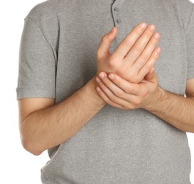 Photo of Man applying cream onto hand against white background, closeup