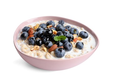 Photo of Tasty oatmeal porridge with blueberries on white background. Healthy meal