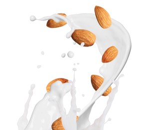 Image of Delicious almond milk and nuts on white background