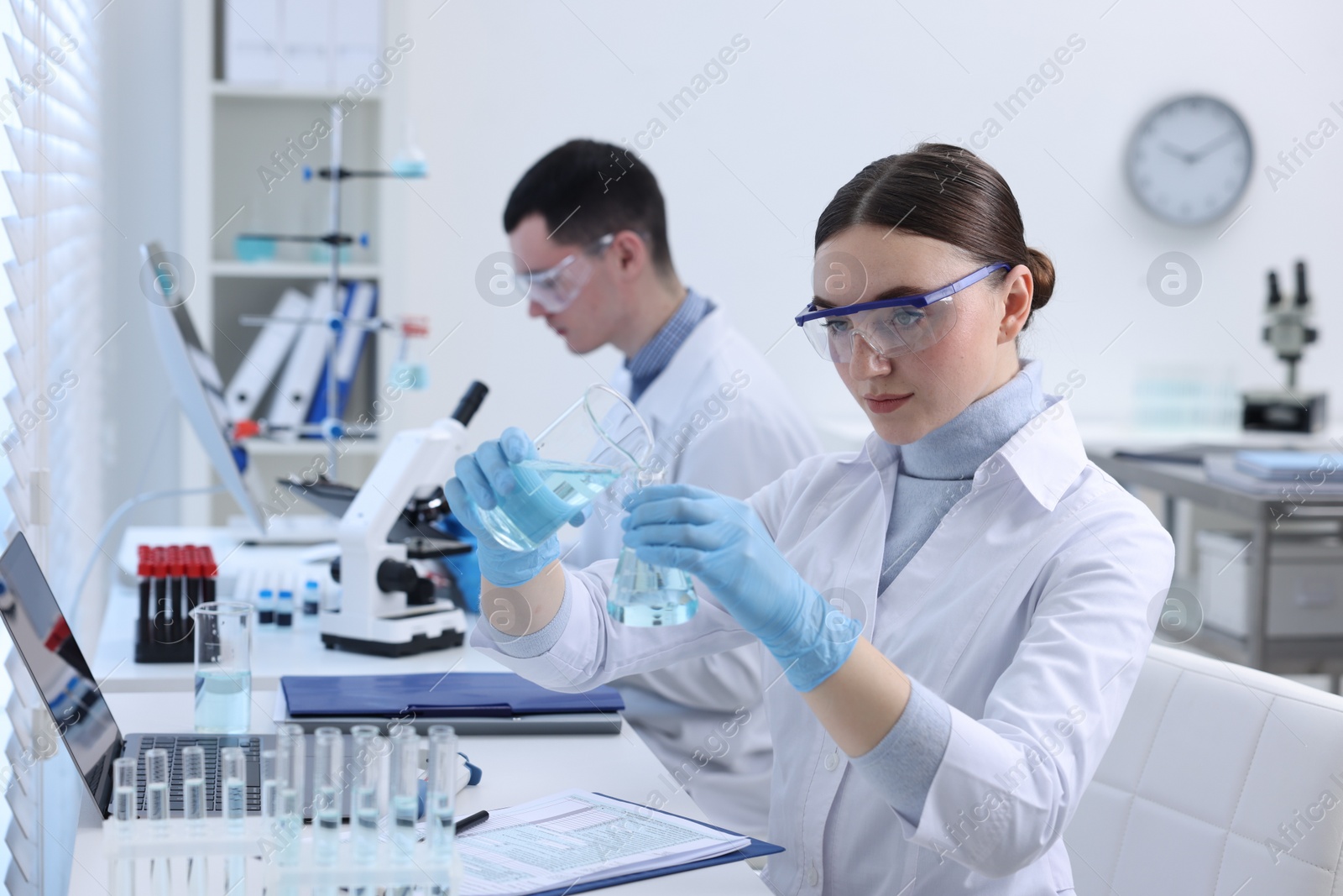 Photo of Scientists working with samples in laboratory. Medical research