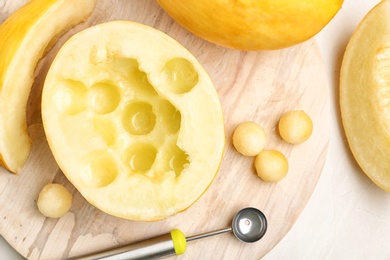 Flat lay composition with melon balls on light background