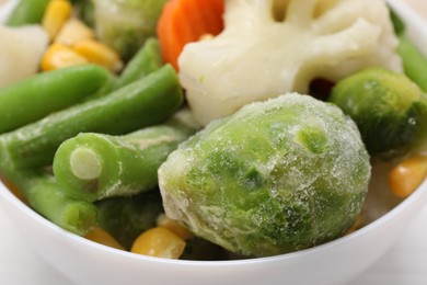 Photo of Mix of different frozen vegetables in bowl, closeup