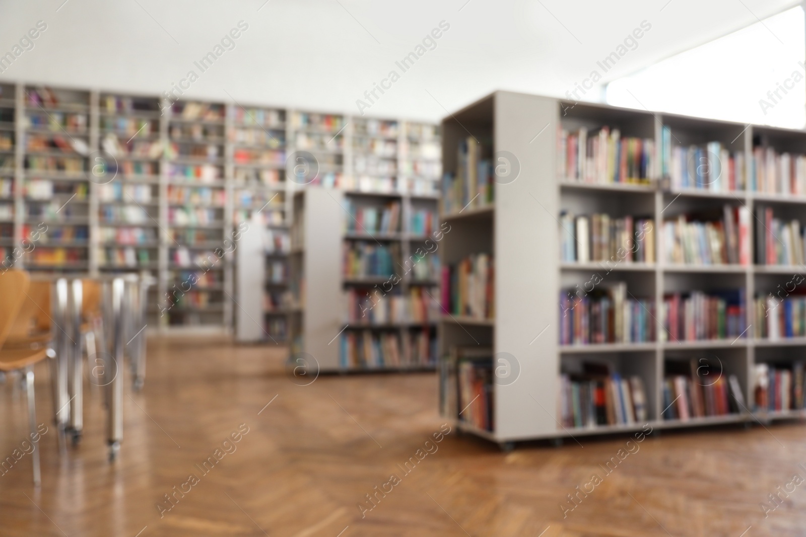 Photo of Blurred view of library interior with bookcases
