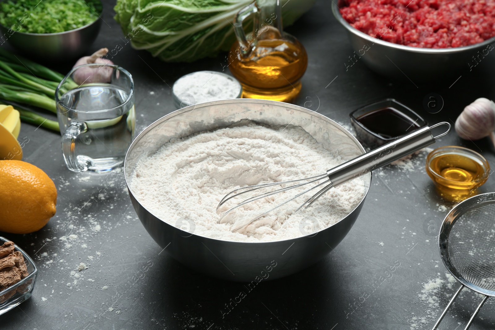 Photo of Composition with ingredients for gyoza on black table