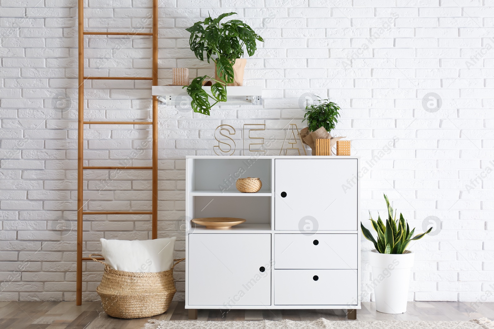 Photo of Chest of drawers in stylish room interior