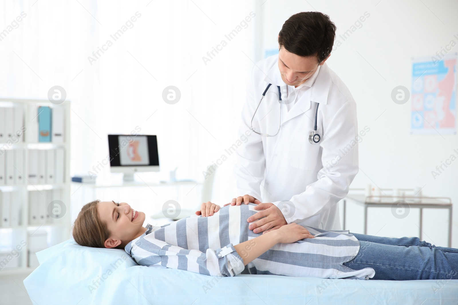 Photo of Gynecology consultation. Pregnant woman with her doctor in clinic