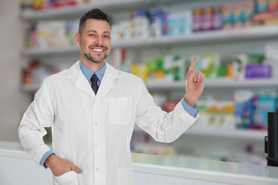 Professional pharmacist working in modern drugstore 