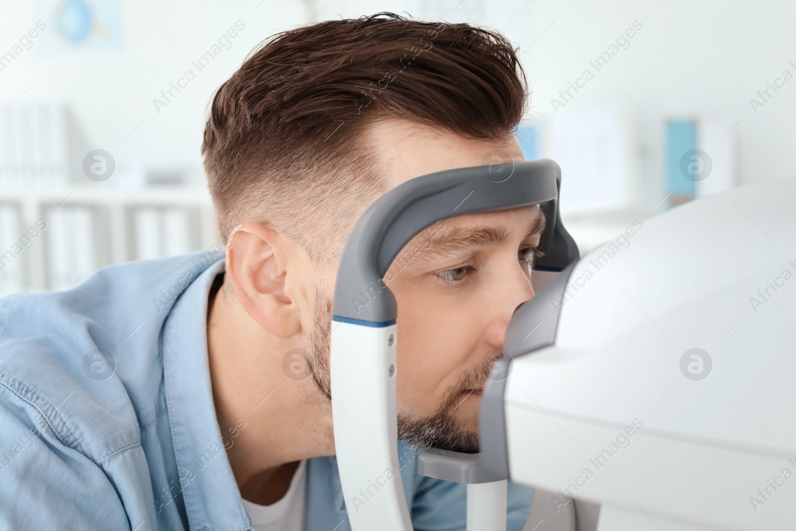 Photo of Man visiting ophthalmologist in clinic