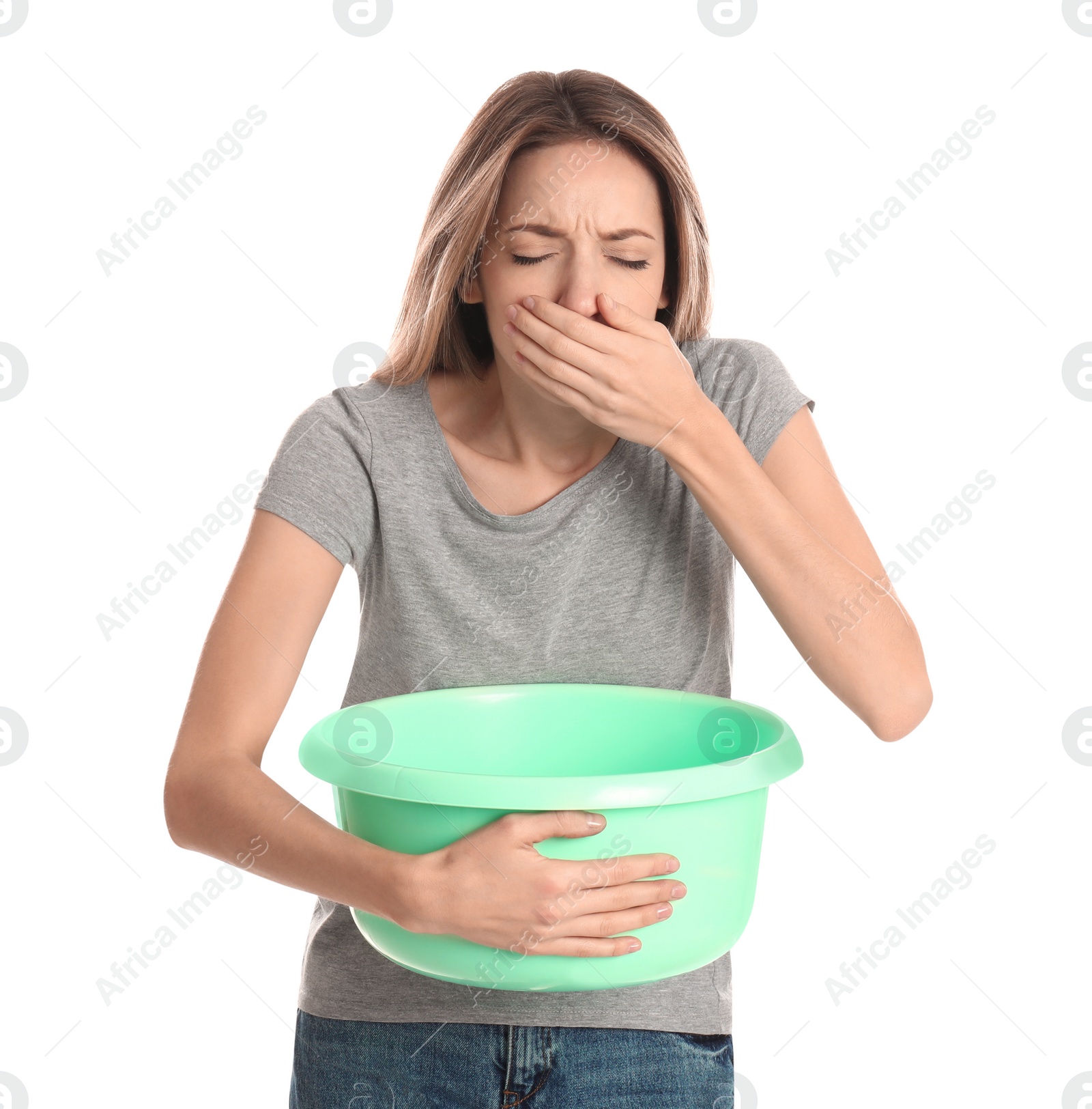 Photo of Woman with basin suffering from nausea on white background. Food poisoning