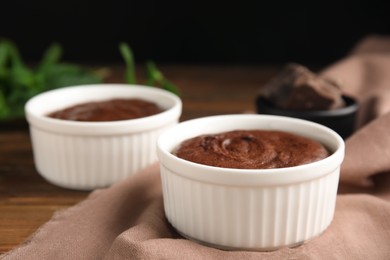 Delicious fresh chocolate fondant on wooden table, closeup