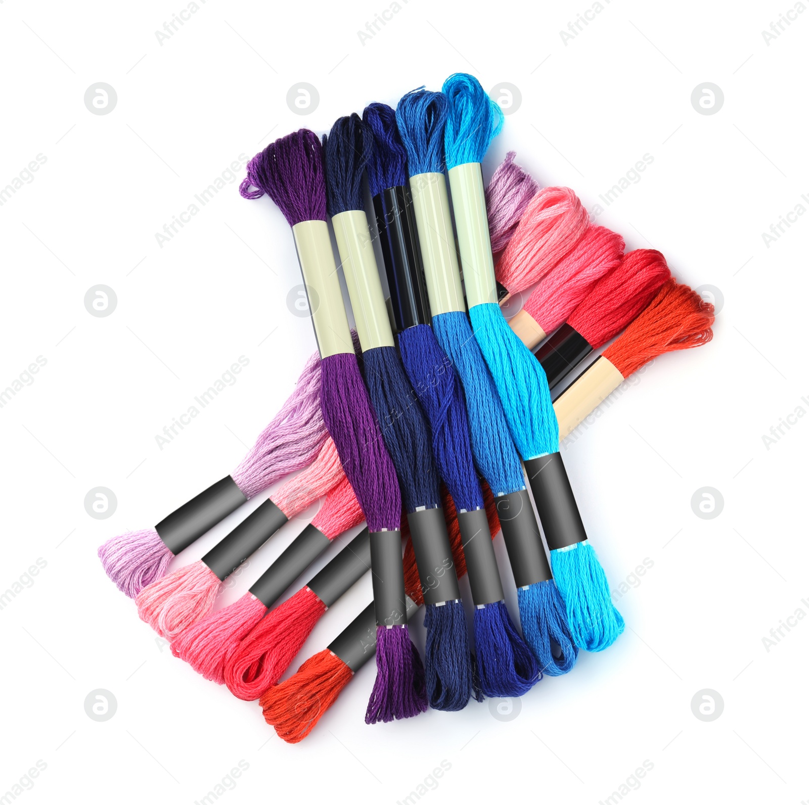 Photo of Set of colorful embroidery threads on white background, top view