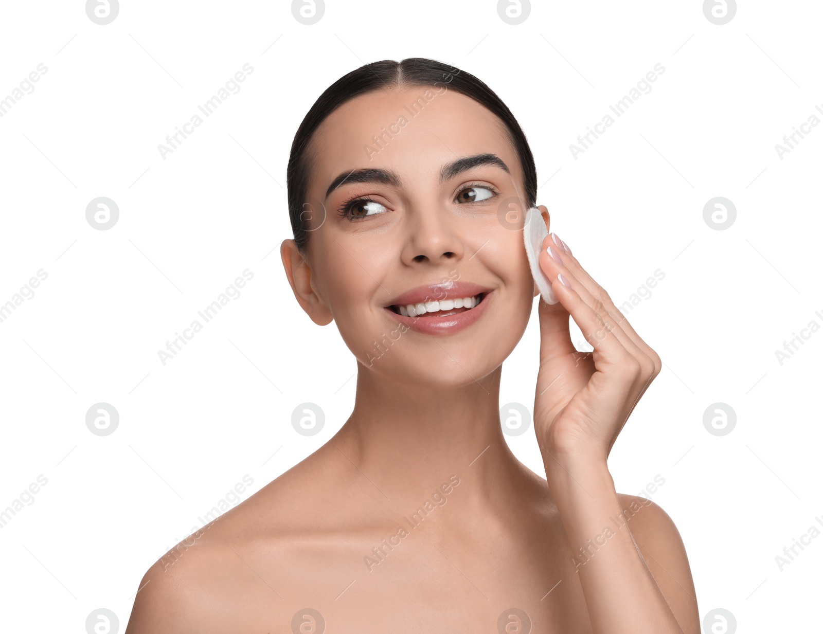 Photo of Beautiful woman removing makeup with cotton pad on white background