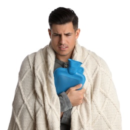 Photo of Ill man with hot water bottle suffering from cold on white background