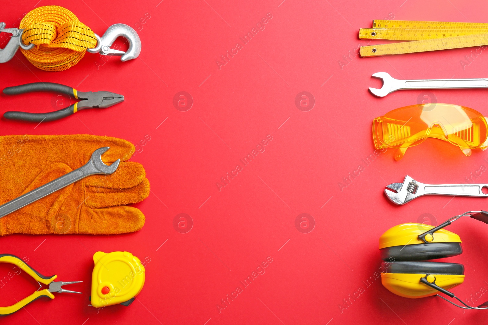 Photo of Flat lay composition with construction tools on color background, space for text