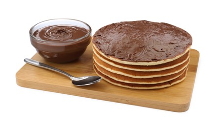 Photo of Tasty pancakes with chocolate paste and spoon isolated on white