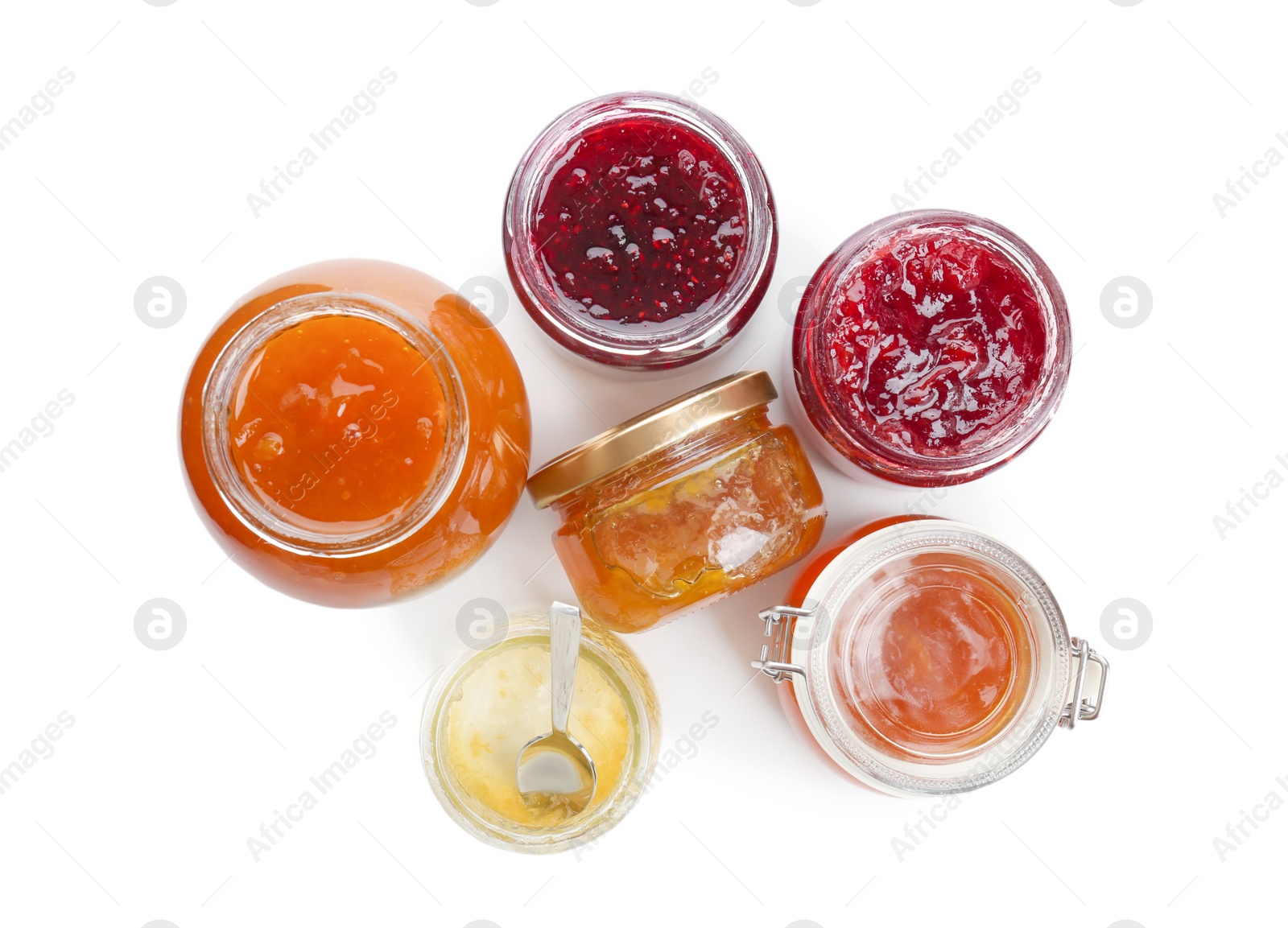 Photo of Jars with different sweet jam on white background