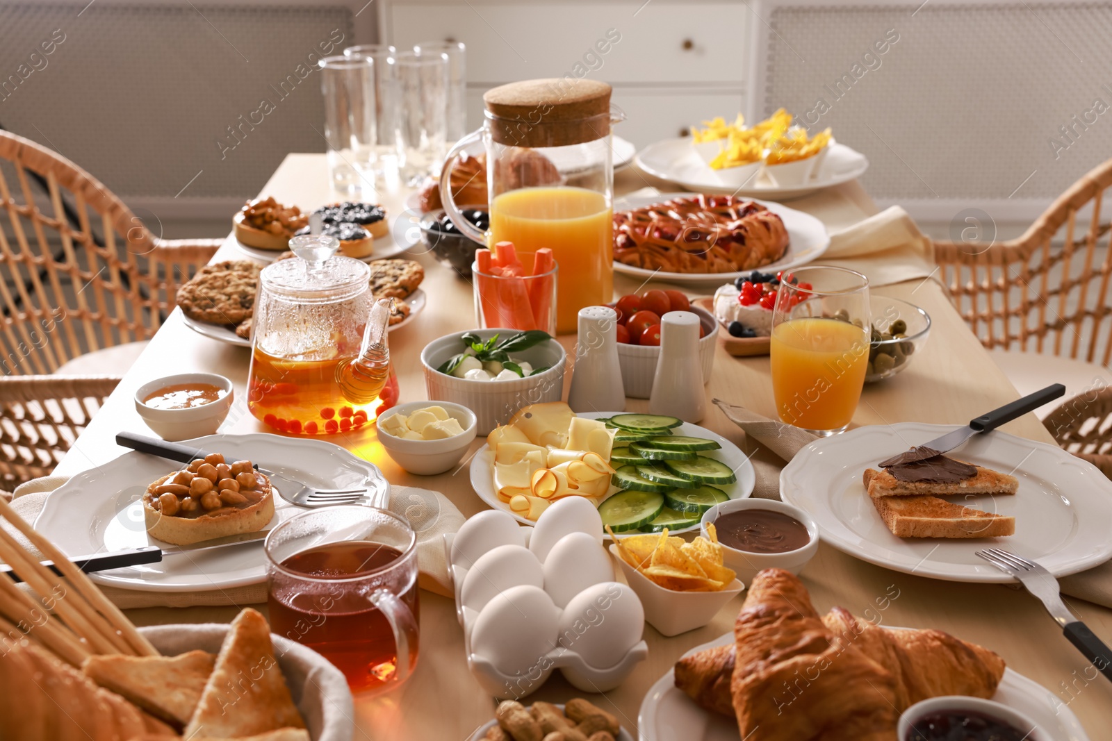 Photo of Dishes with different food on table in room. Luxury brunch