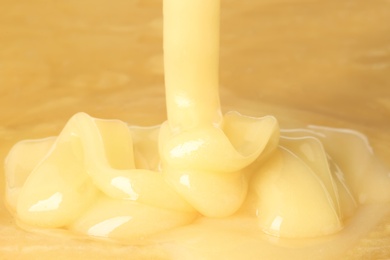 Photo of Pouring fresh sweet honey, closeup