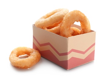 Photo of Box with fried onion rings on white background