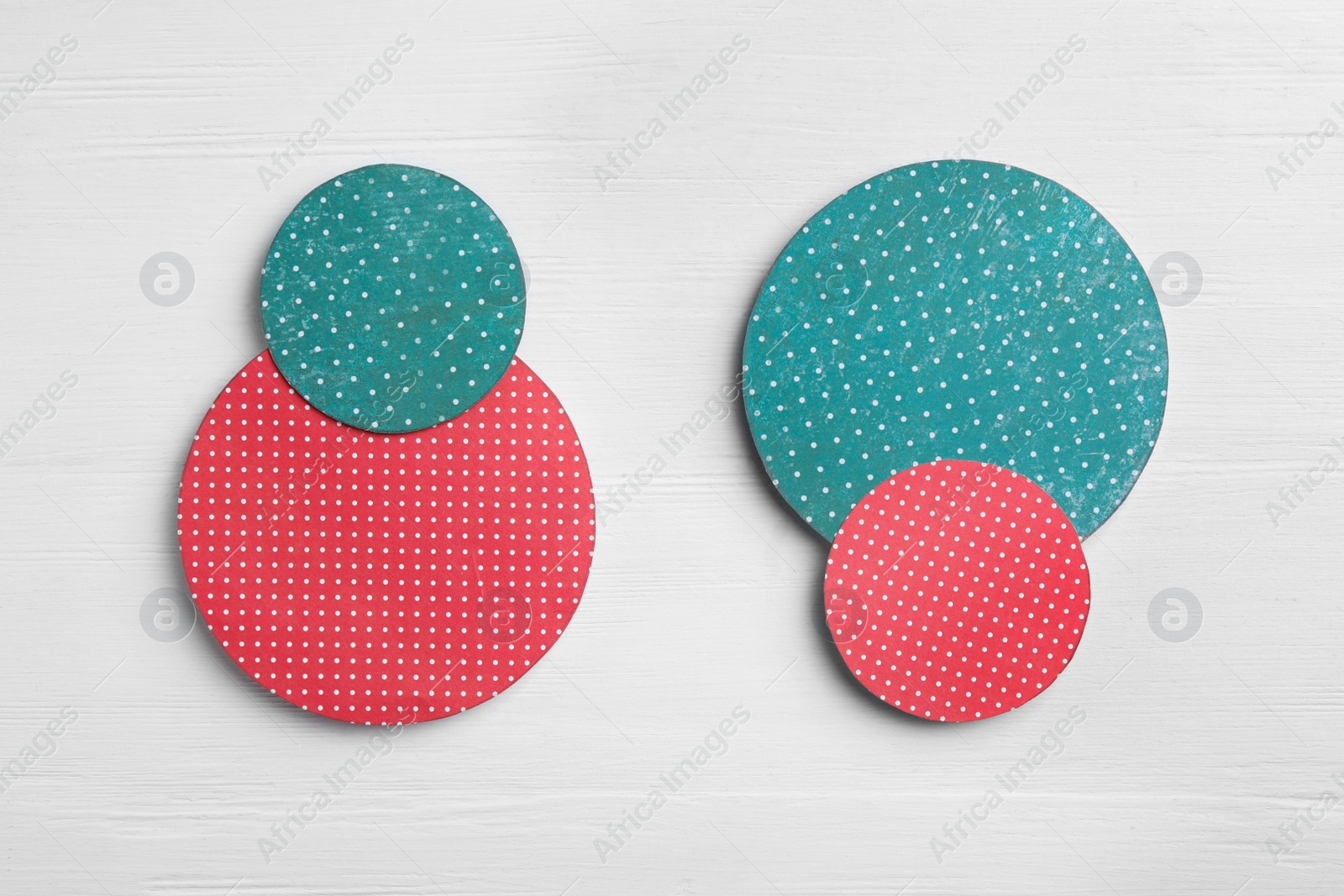 Photo of Red and green circles on white wooden background, flat lay. Pareto principle concept