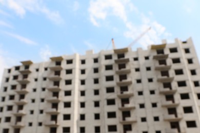 Blurred view of unfinished white building outdoors