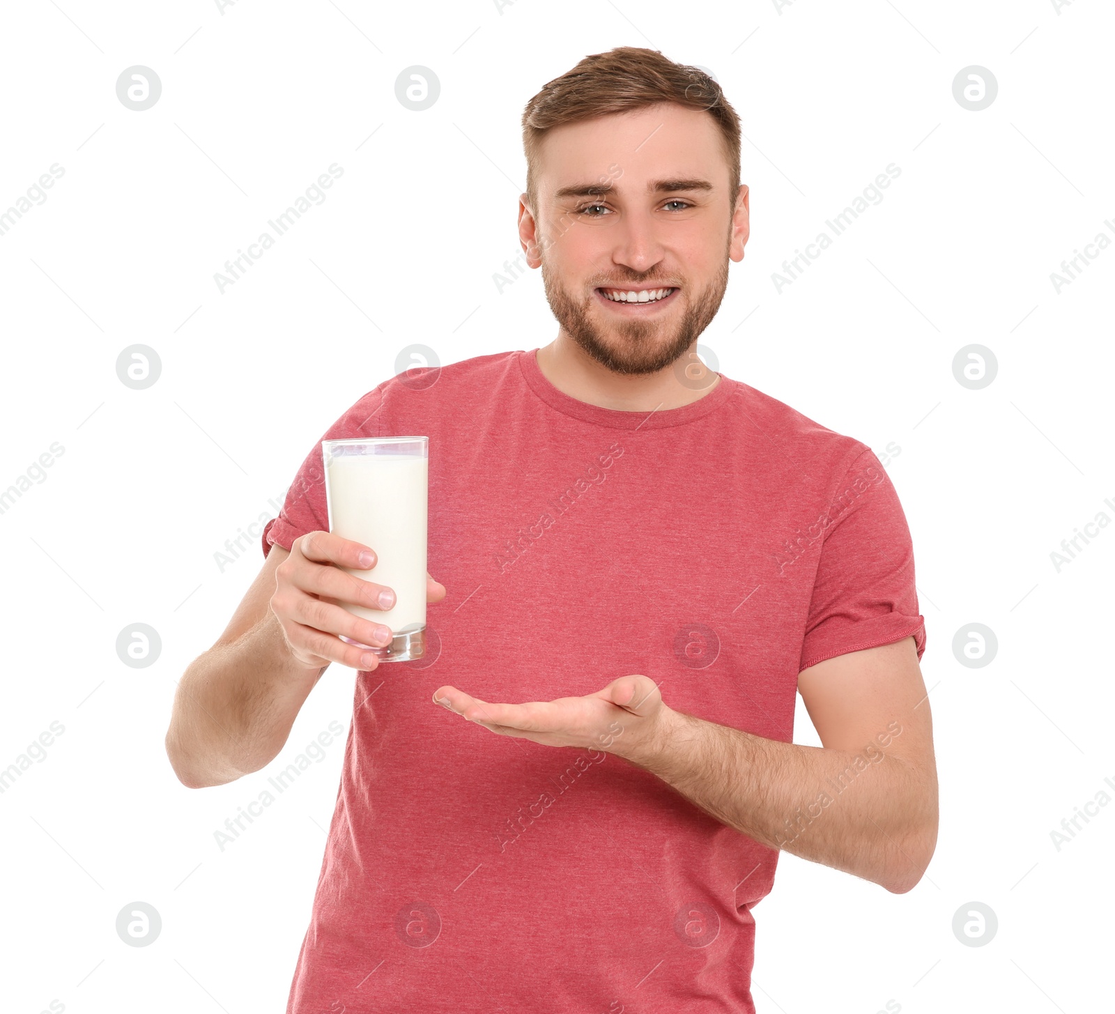 Photo of Young man with glass of tasty milk on white background