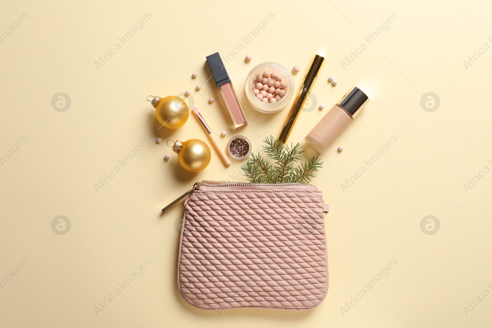 Photo of Flat lay composition with makeup products and Christmas decor on color background