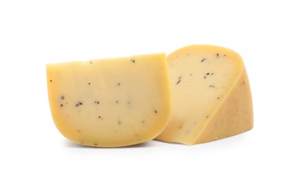 Photo of Pieces of delicious truffle cheese on white background