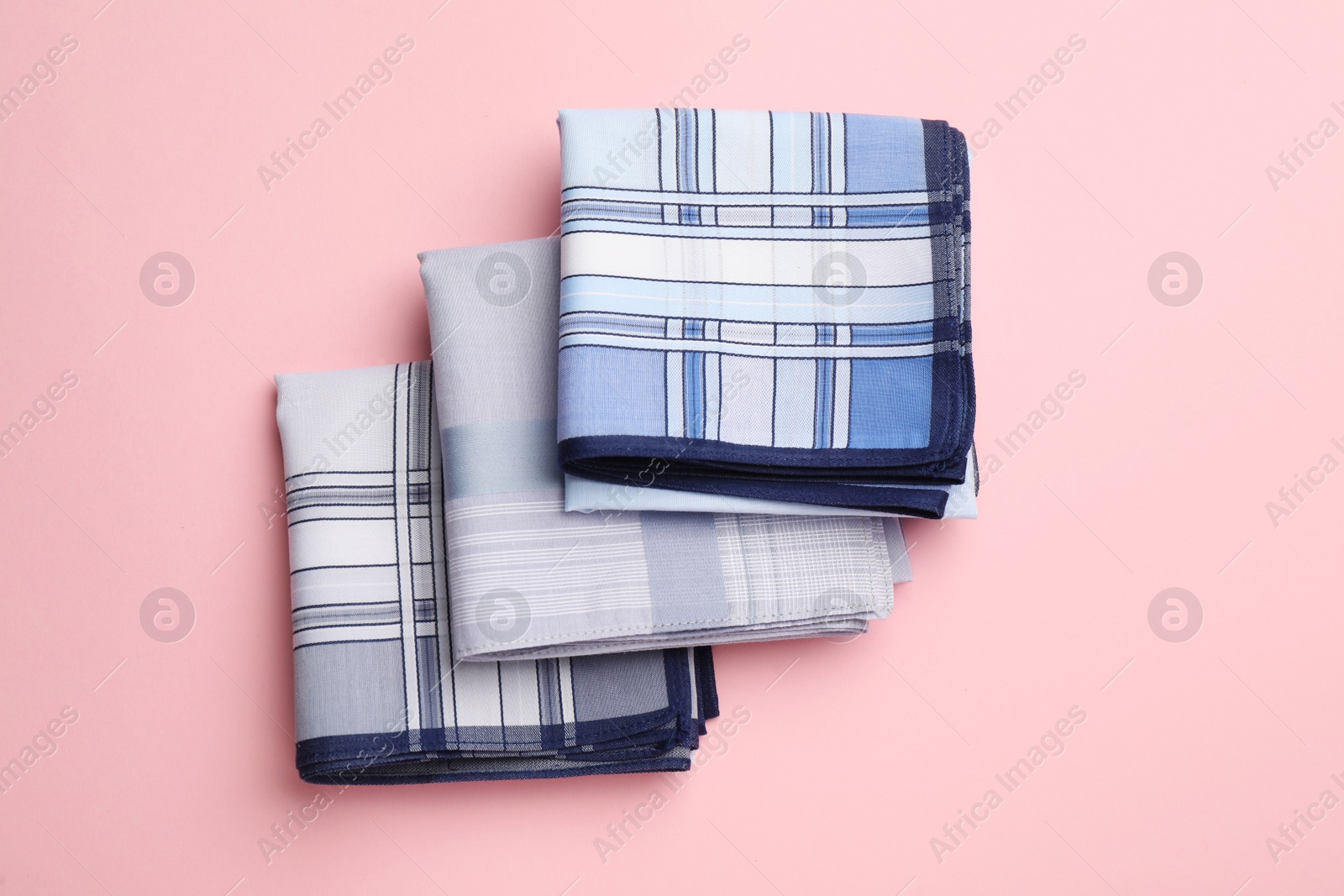 Photo of Stylish handkerchiefs on pink background, flat lay