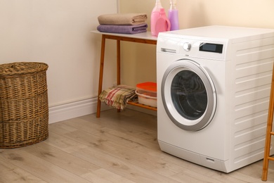 Laundry room interior with modern washing machine