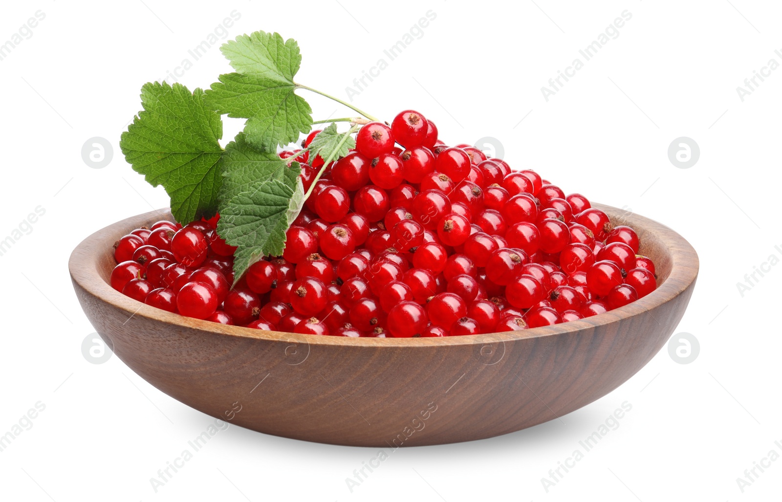 Photo of Tasty ripe red currants and green leaves in bowl isolated on white