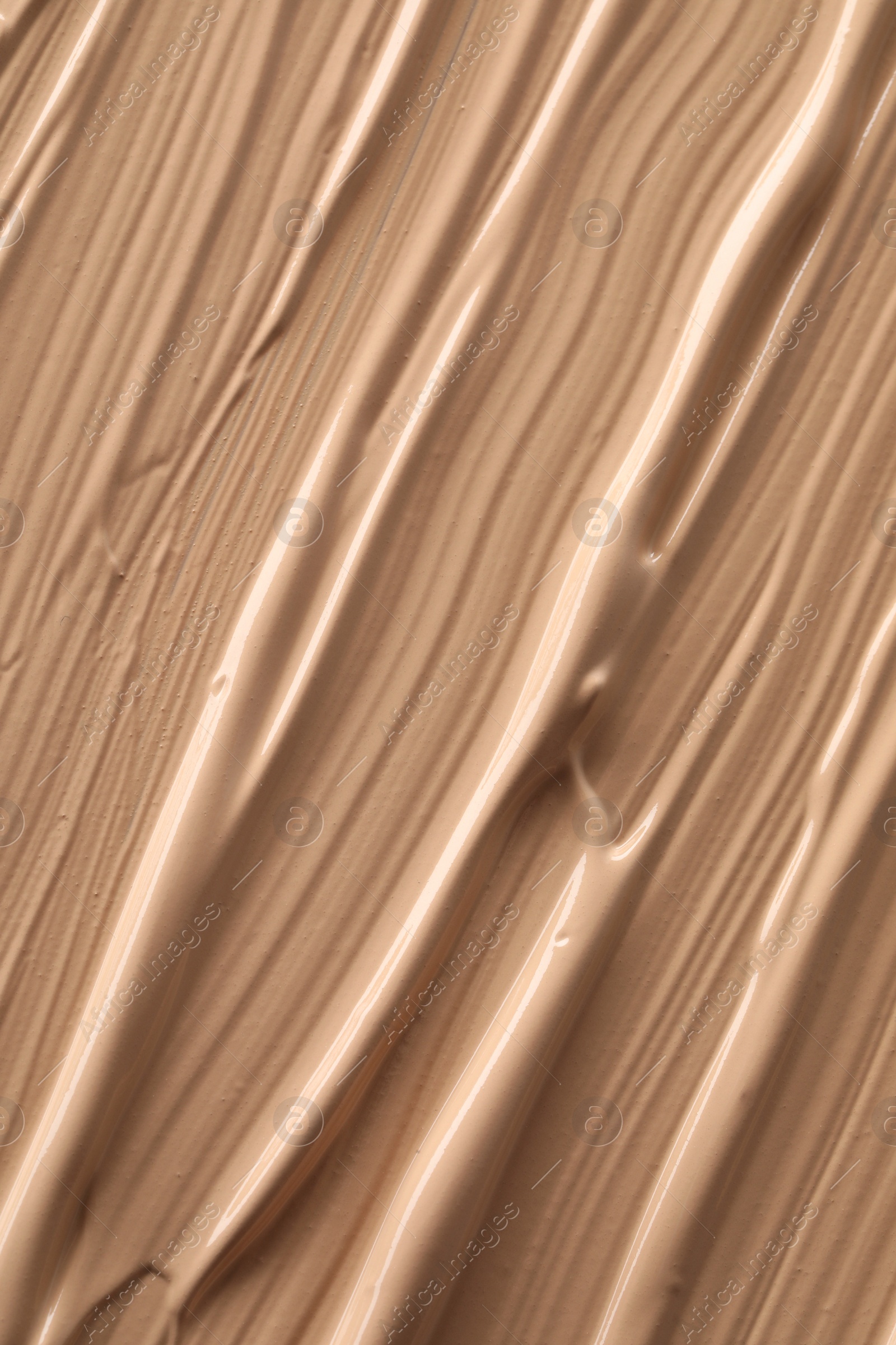 Photo of Texture of liquid skin foundation as background, closeup