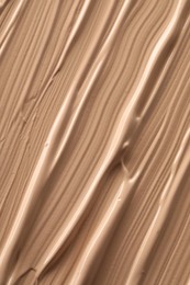 Texture of liquid skin foundation as background, closeup