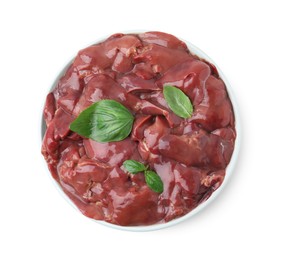 Plate of raw chicken liver with basil isolated on white, top view