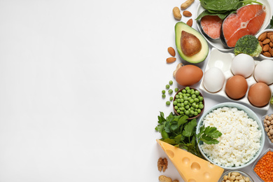 Photo of Different products rich in protein on white background, flat lay