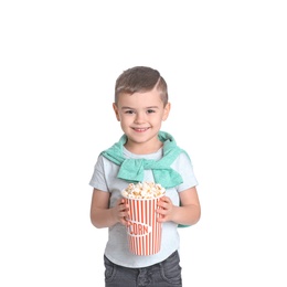 Photo of Cute little boy with popcorn on white background