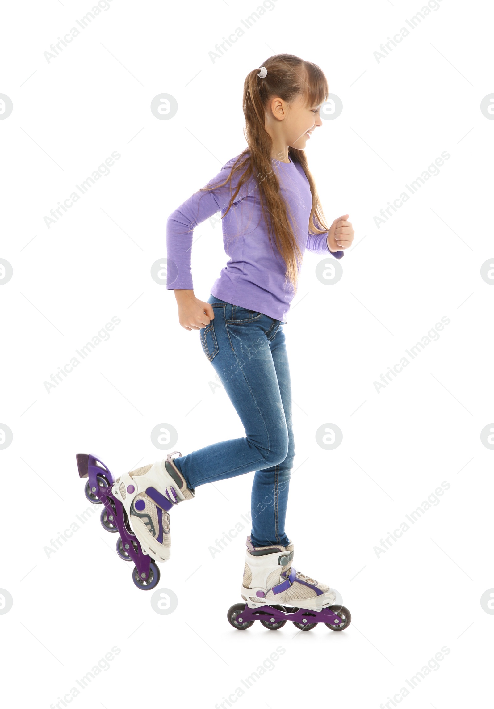 Photo of Little girl with inline roller skates on white background