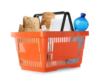 Image of Plastic shopping basket with different products isolated on white 